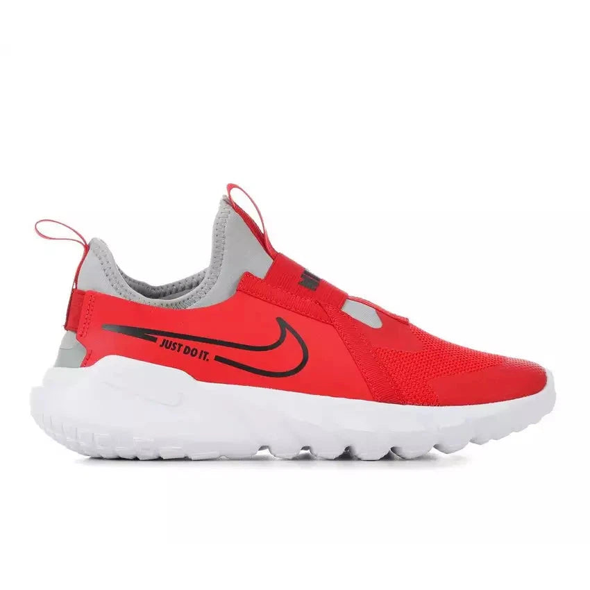 A red Nike Flex Runner 2 sneaker for little kids with a white sole and black detailing. It features a slip-on design with a bootie-like construction and strap closures.