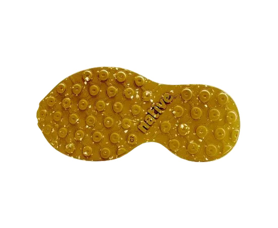 Gold-colored shoe sole with 'Native' branding on a white background