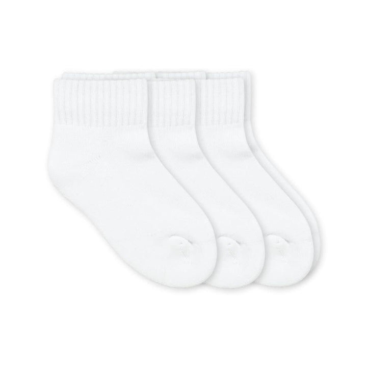 Three pairs of white socks on a white background