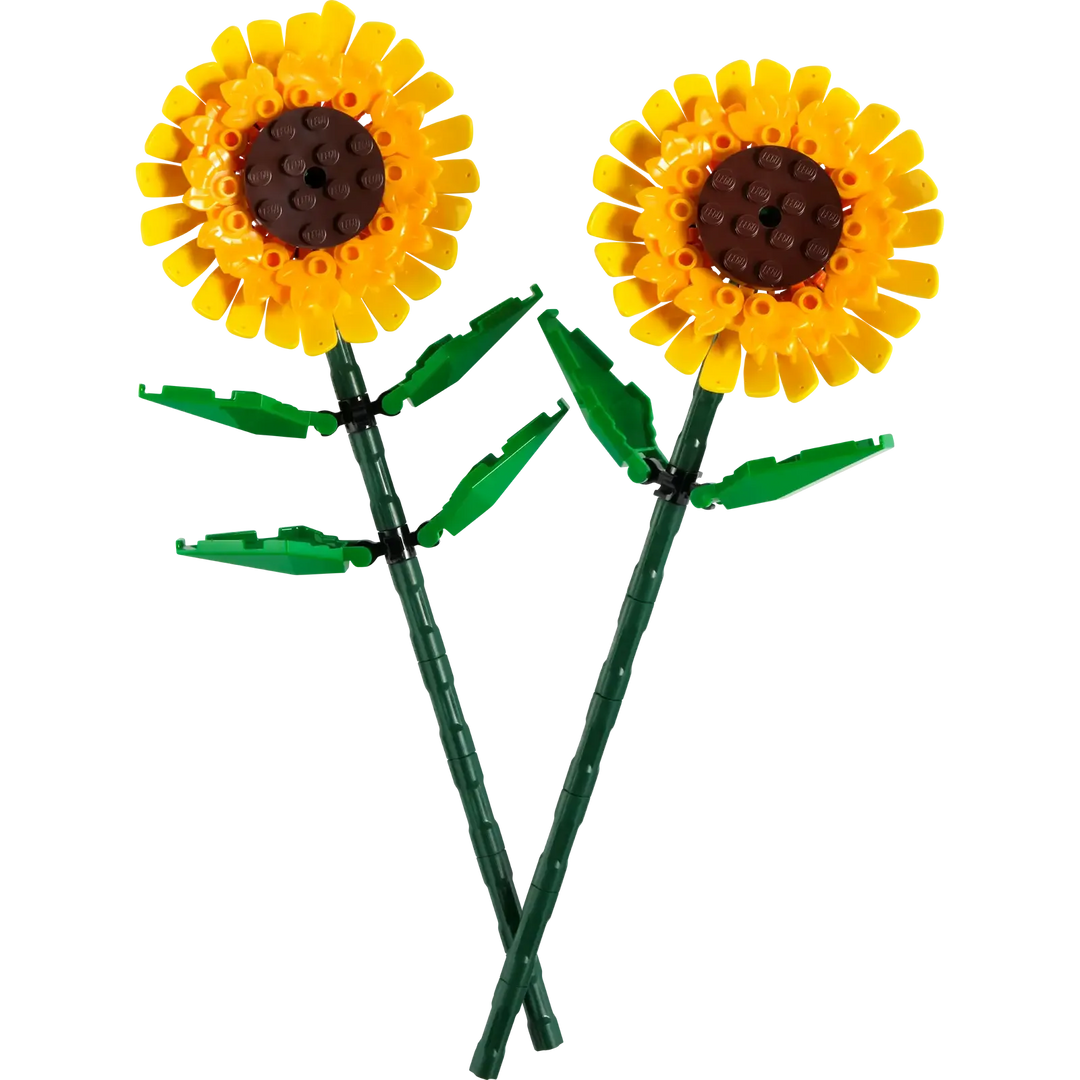 Two sunflower-shaped objects made from interlocking bricks on a white background