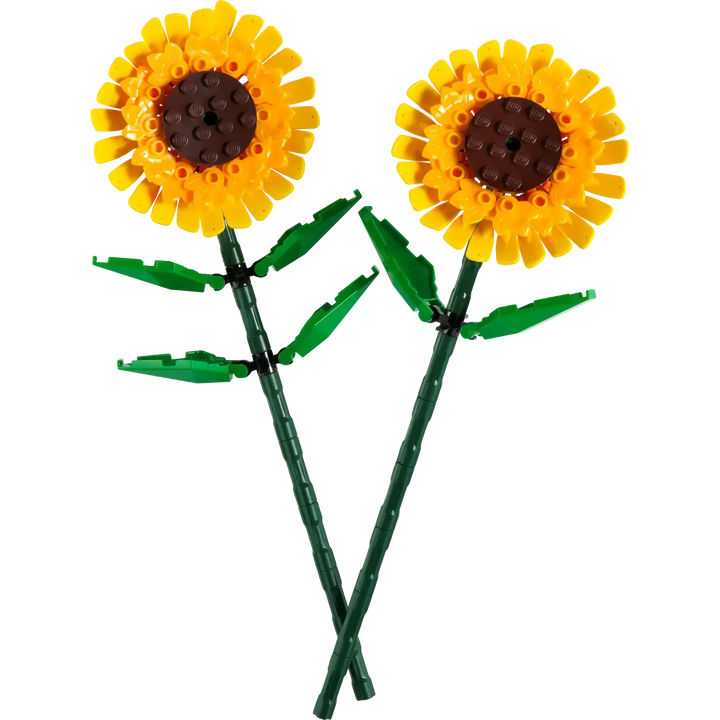 Two sunflower-shaped objects made from interlocking bricks on a white background