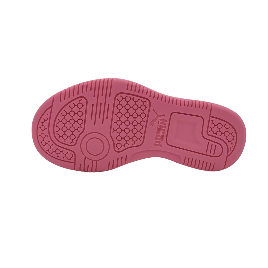 Pink sneaker sole with tread pattern on a light gray background
