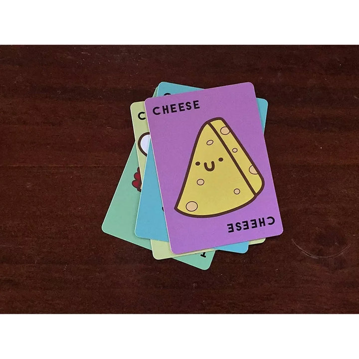 Colorful card with a cheese illustration on a wooden surface