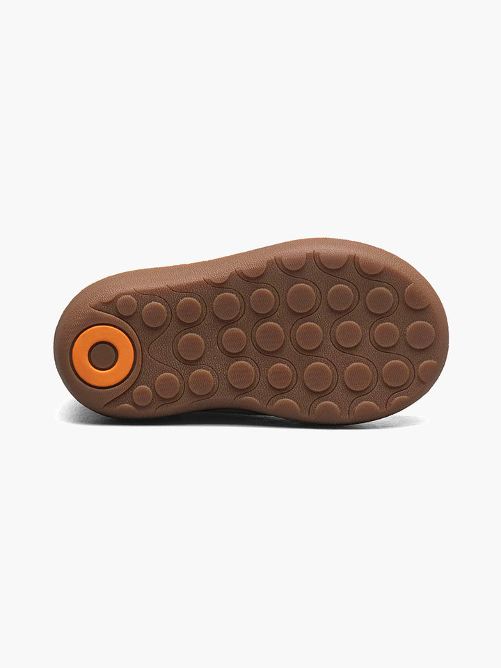 Tan sole of a shoe on a white background