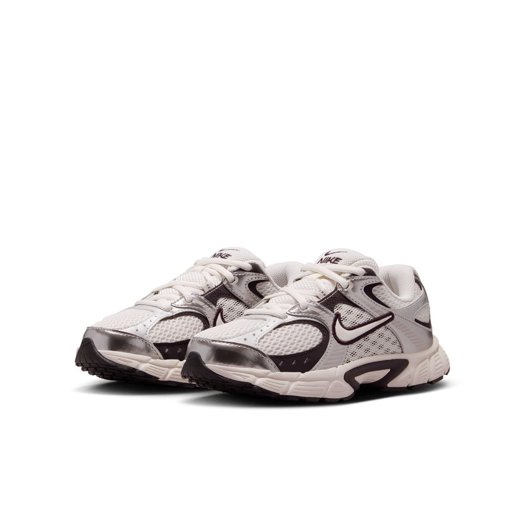 Pair of white and black sneakers on a white background