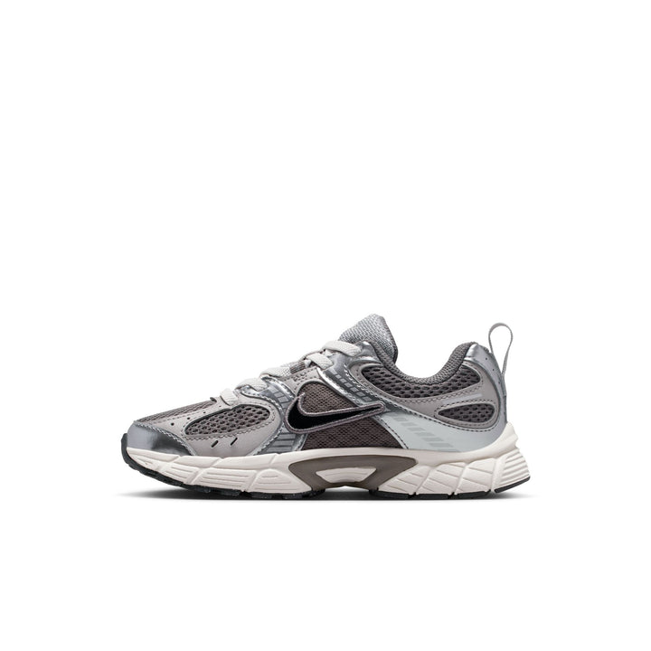 A Nike sneaker in metallic silver and gray with a white midsole, shown from the side profile on a white background.