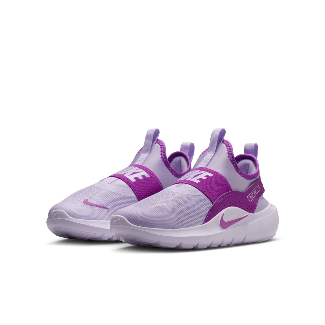 Purple and white Nike sneakers on a white background