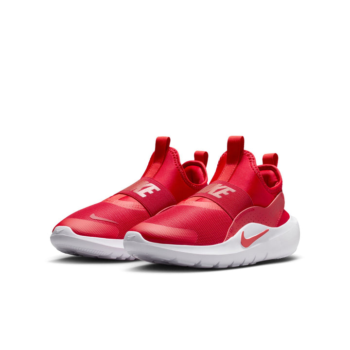 Red Nike sneakers with white soles on a white background