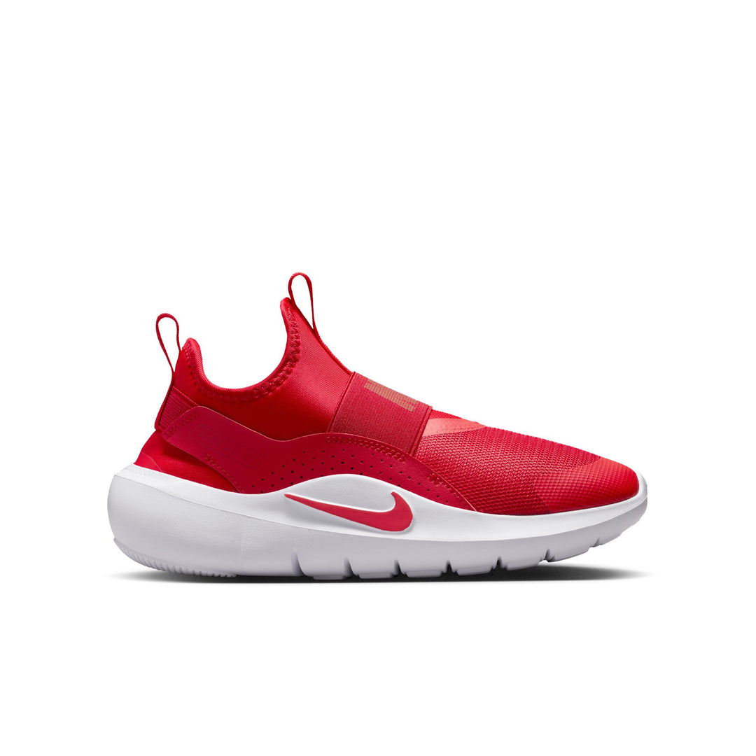 Red sneaker with white sole on a white background