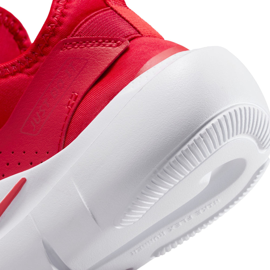 Red sneaker with white sole on a white background