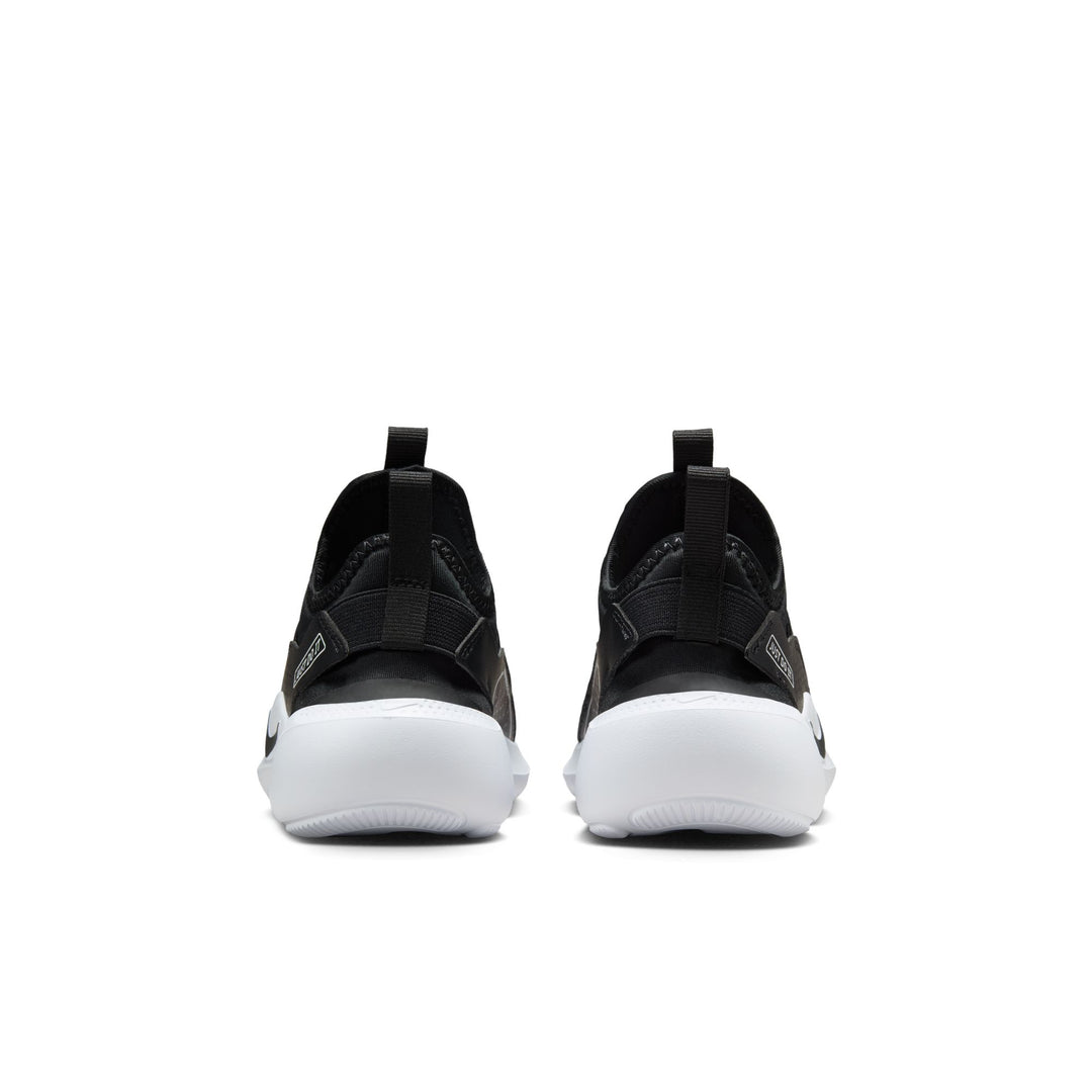 Black slip-on sneakers with white soles on a white background