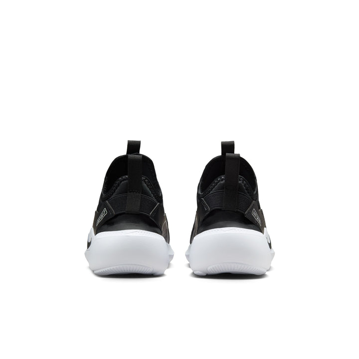 Black slip-on sneakers with white soles on a white background