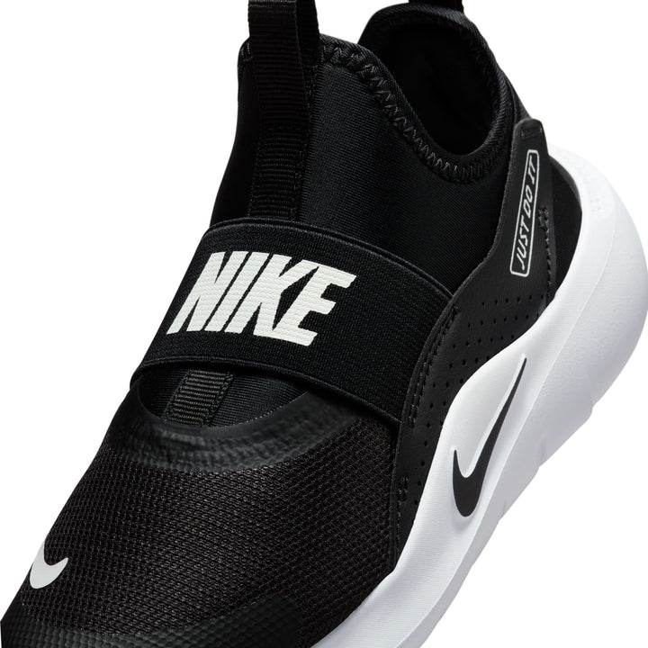 Black Nike sneaker with white sole on a white background