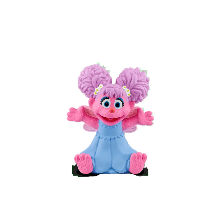 Toy figure with pink hair and blue body on a white background
