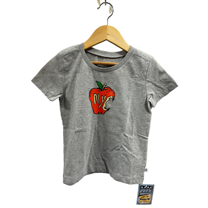 Gray t-shirt with a red apple graphic on a hanger against a white wall.