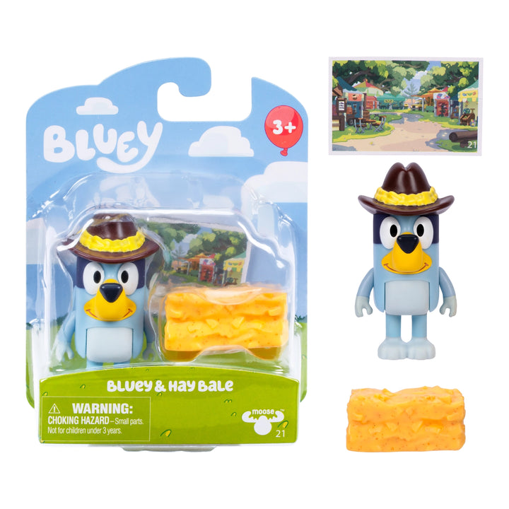 Bluey toy figure with cowboy hat and hay bale in packaging, featuring the Bluey brand.