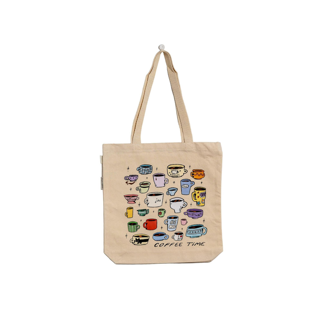 Beige tote bag with colorful coffee cup illustrations and 'Coffee Time' text on a light gray background