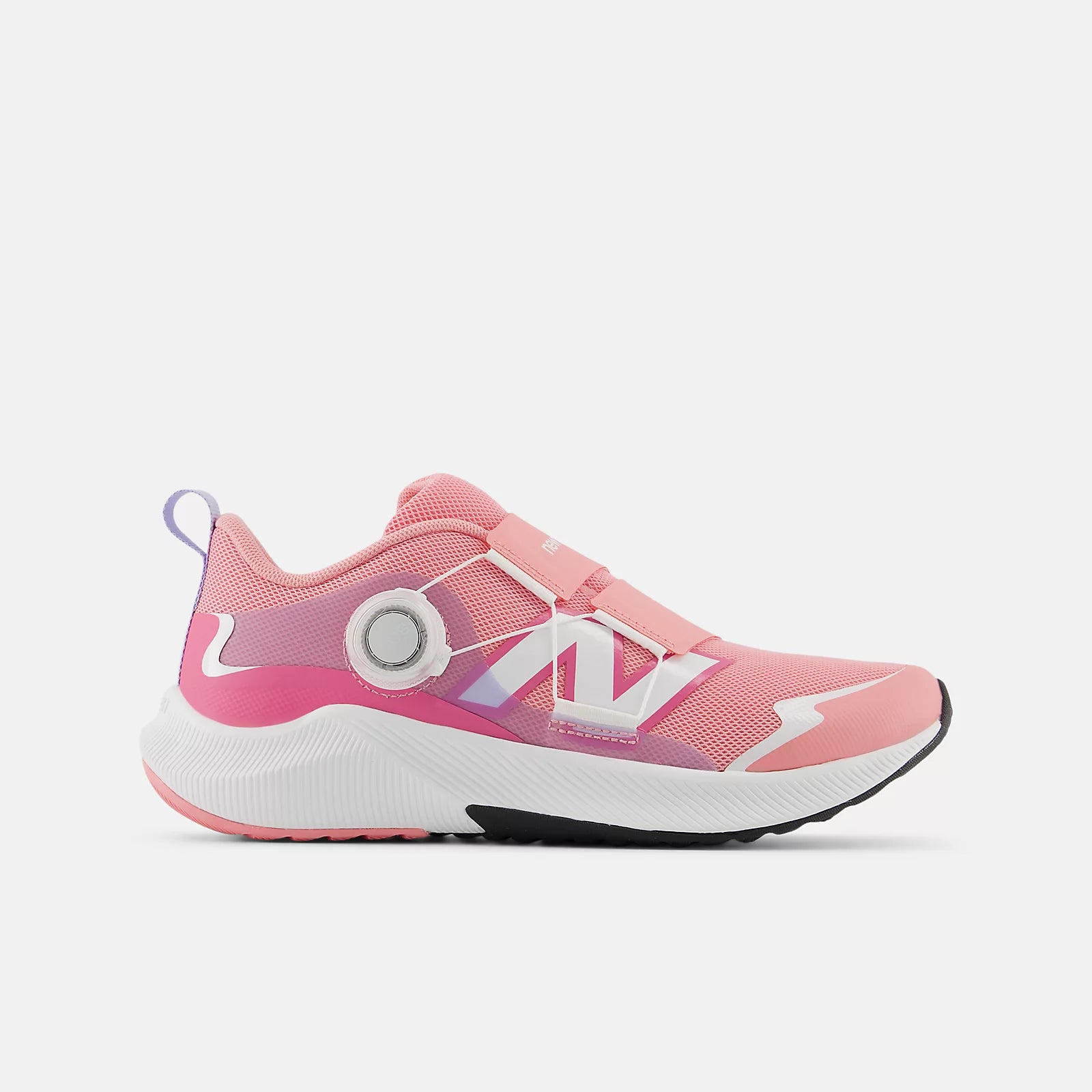 Pink running shoe with white sole on a light gray background