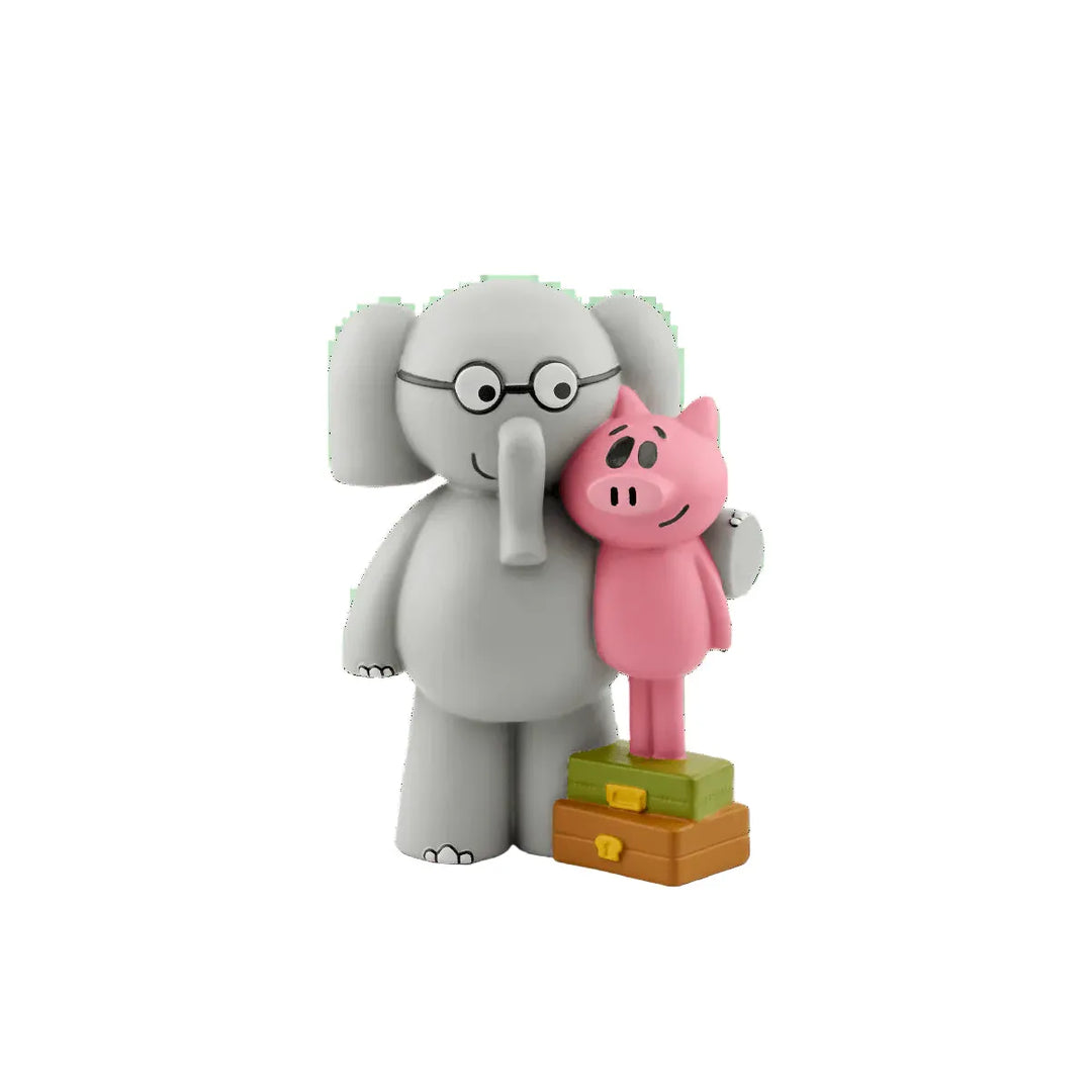 Gray elephant and pink piggy bank figurines on a white background