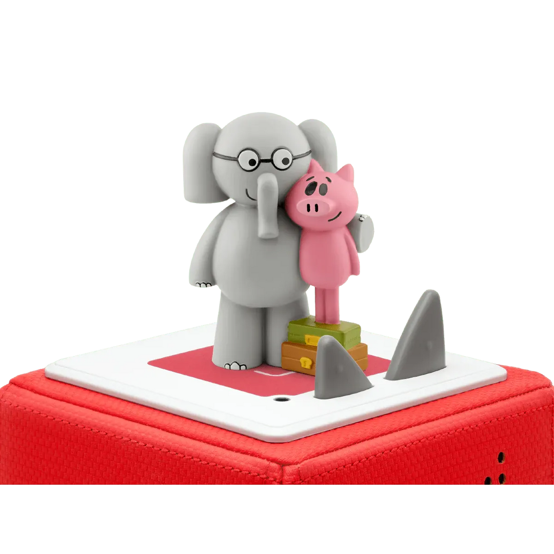 Toy figure of an elephant and a pig on a red base with shark fins.