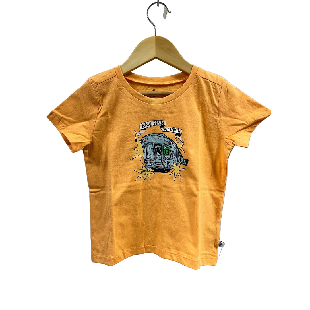 Yellow t-shirt with graphic design on a hanger against a gray background
