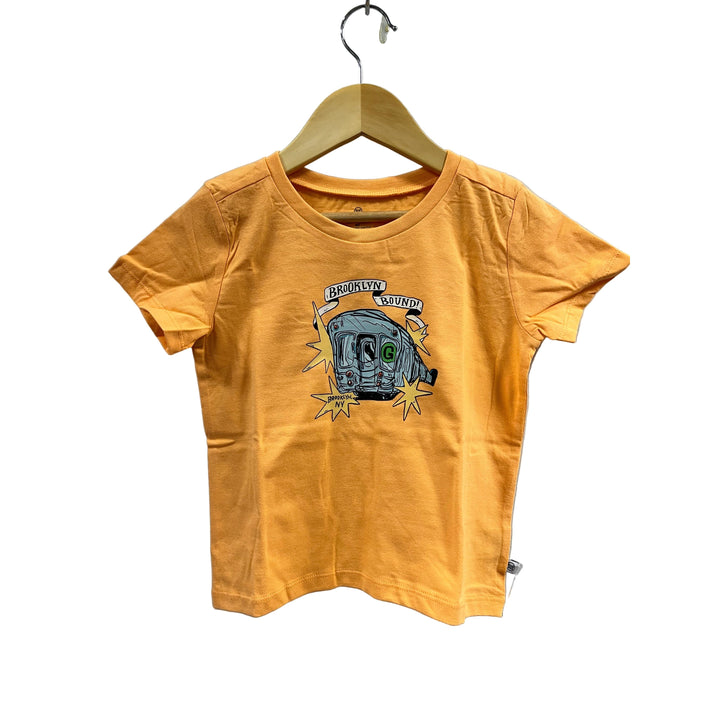 Yellow t-shirt with graphic design on a hanger against a gray background