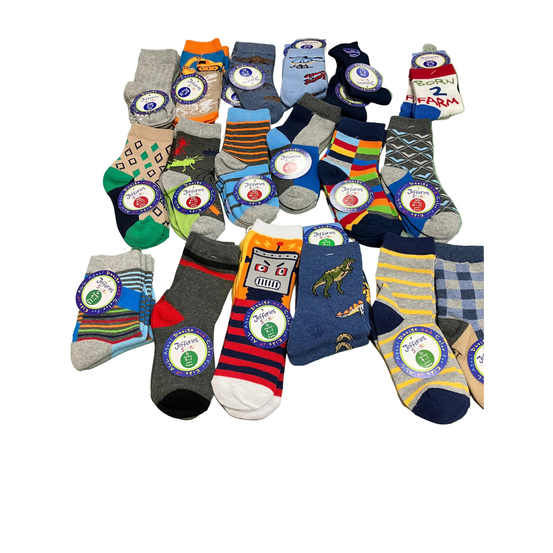 Assorted colorful socks with brand labels on a green surface