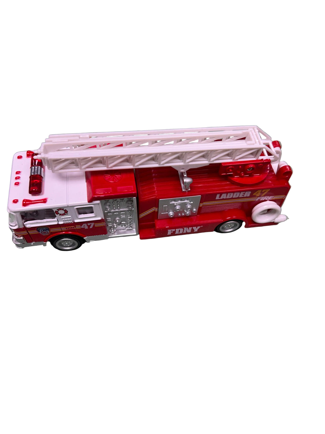 Toy fire truck model on a gray surface