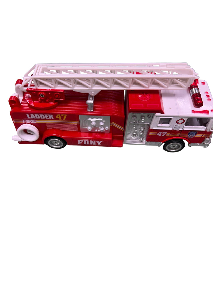 Toy fire truck model on a gray surface
