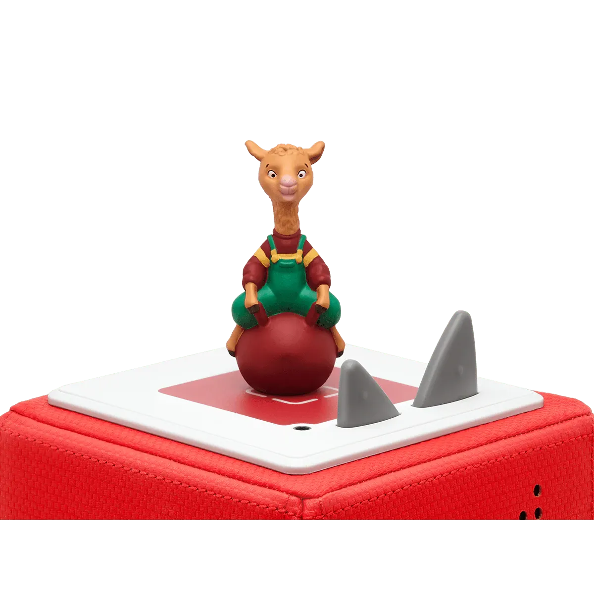Toy figure of a character on a red ball with shark fin design on a white background