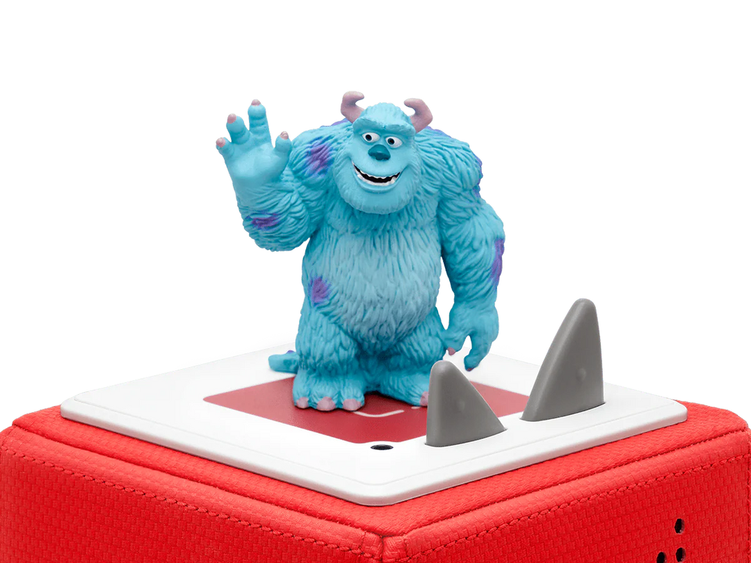 Blue monster figurine on a red and white base with a white background