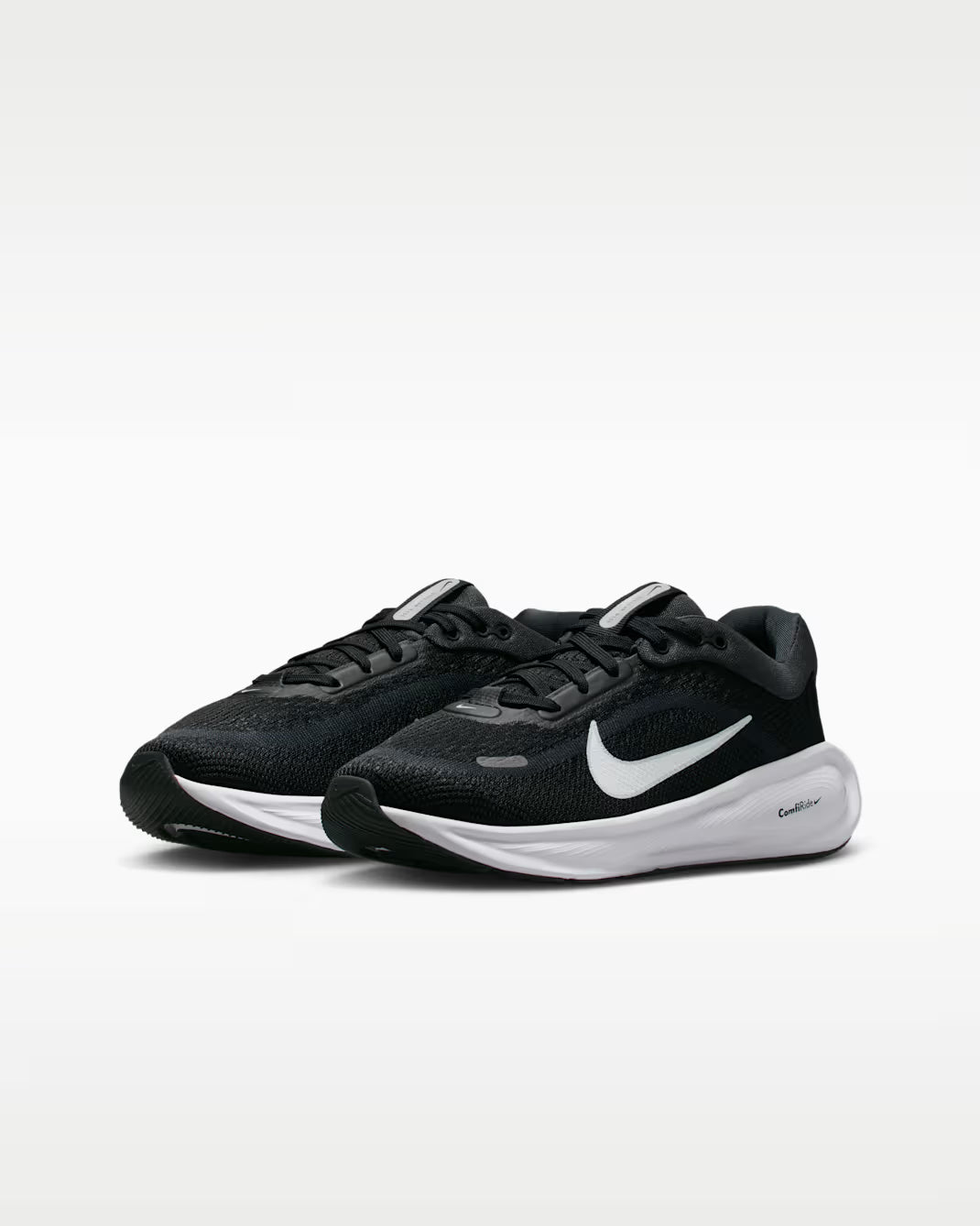 Purple and black Nike sneakers on a white background