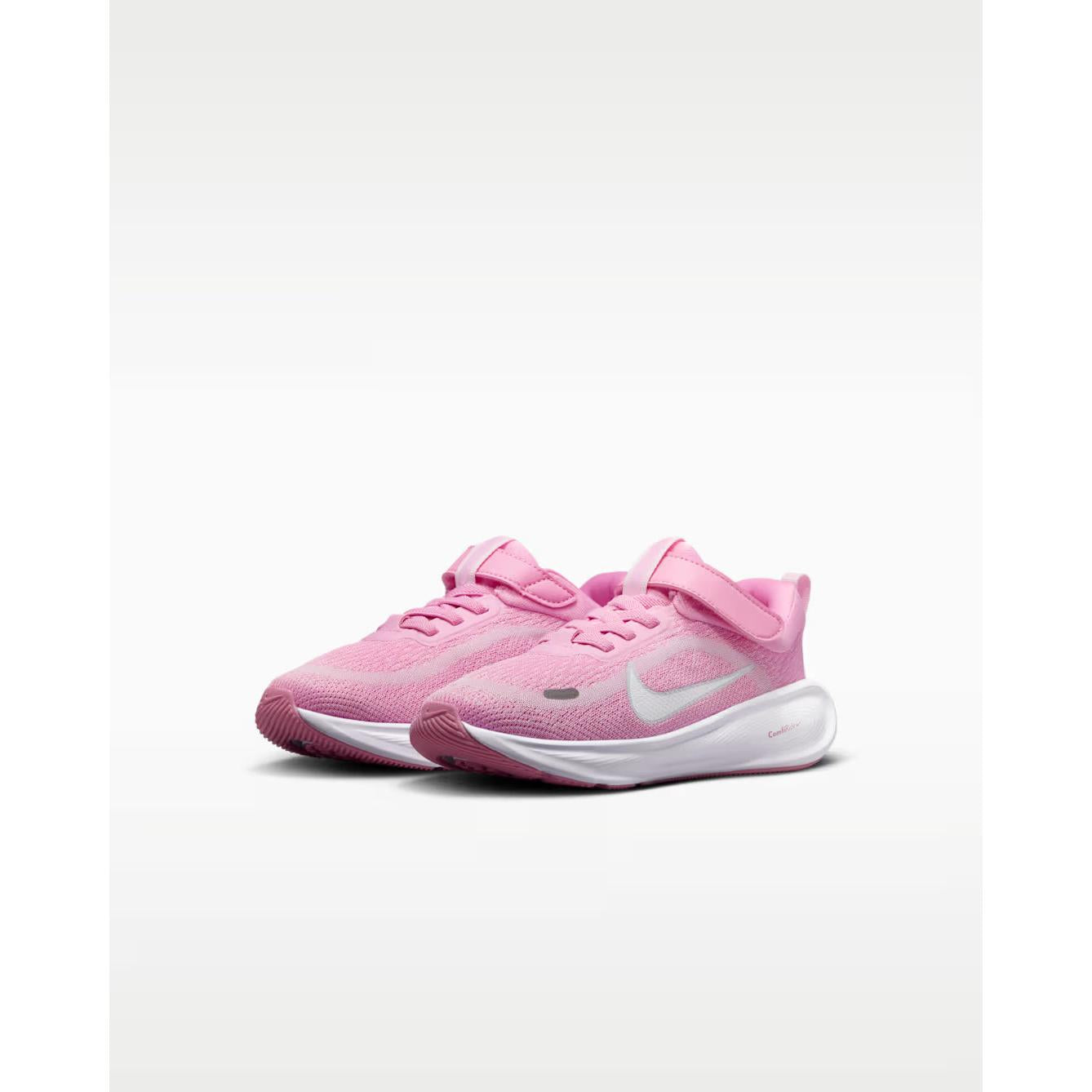 Pink running shoes with a white logo on a light gray background
