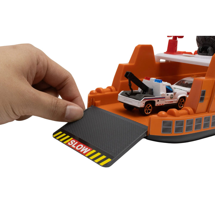 Toy boat with a hand placing a 'SLOW' mat on top
