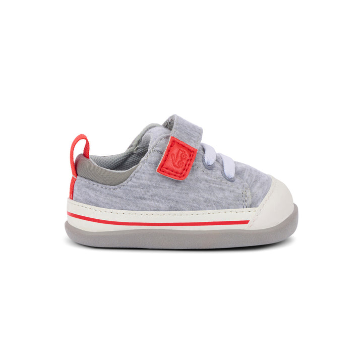 Gray and red children's shoe on a white background
