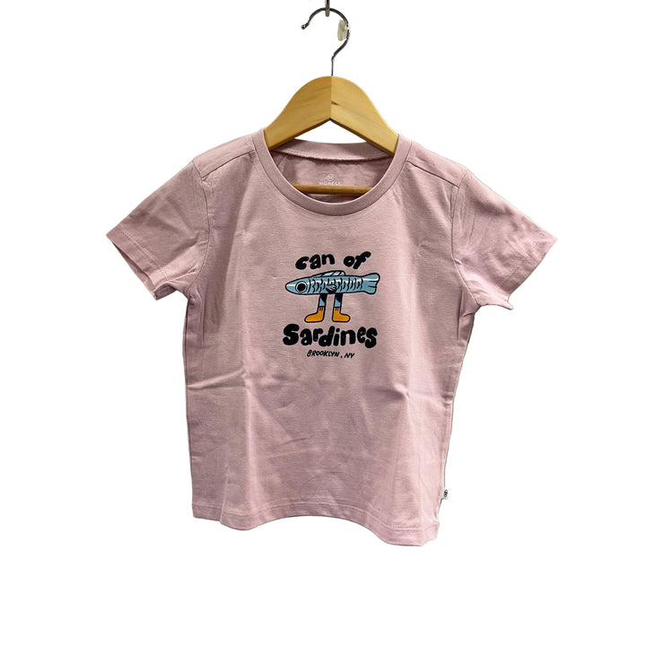 Pink t-shirt with graphic design on a hanger against a gray wall