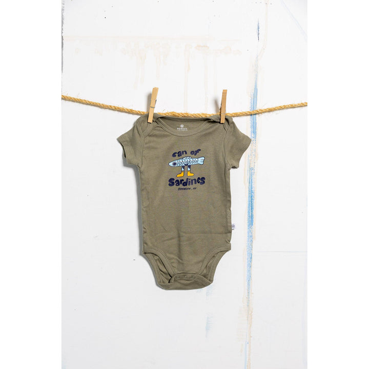 Green baby onesie with text and graphics on a white background