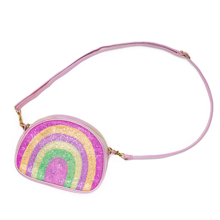 A multicolored glittery purse with a rainbow design and a pink strap.