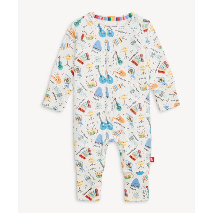 Baby onesie with musical instrument pattern on a white background