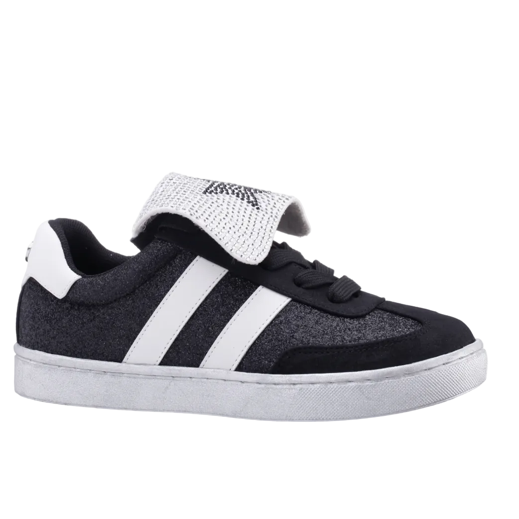 Black and white sneaker with a strap on a white background