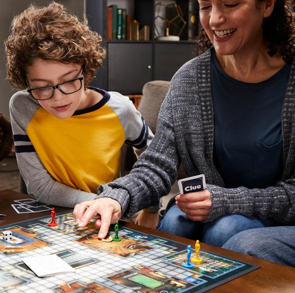 Woman and child playing a board game together