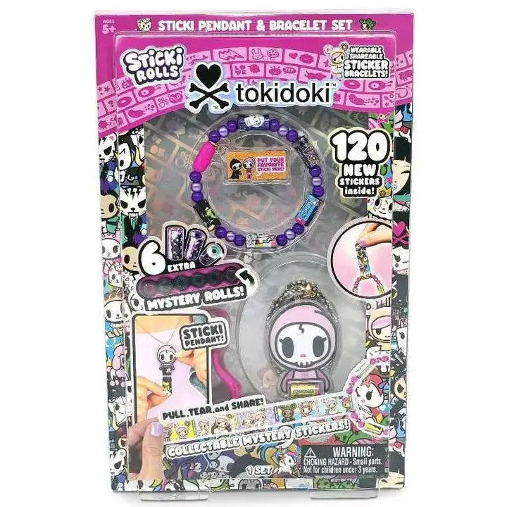 Tokidoki Sticki Pendant &amp; Bracelet Set in retail packaging, featuring a purple beaded bracelet, a character pendant, and promotional graphics for stickers and mystery rolls.