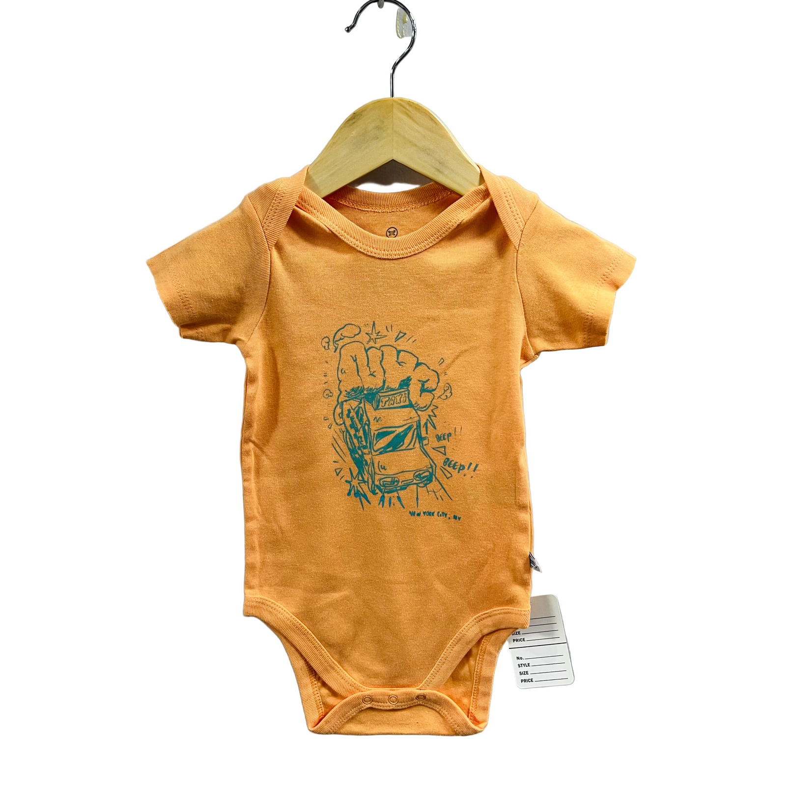 Yellow baby onesie with a graphic design on a hanger against a gray background