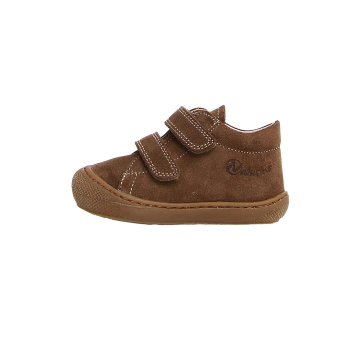 Brown children's shoe with velcro straps on a white background