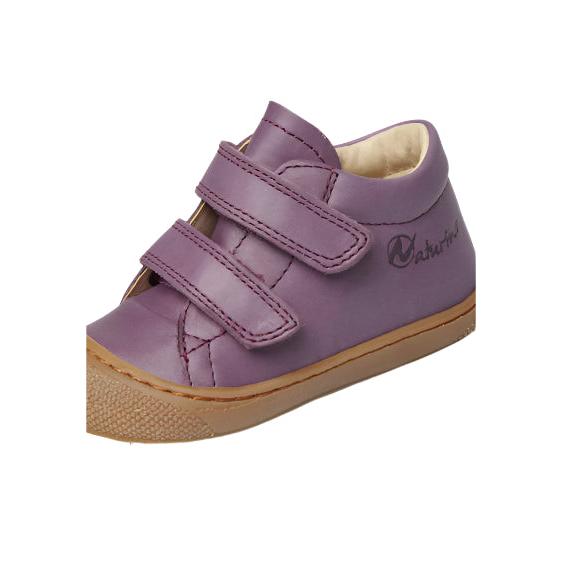 Purple children's shoe with velcro straps on a white background