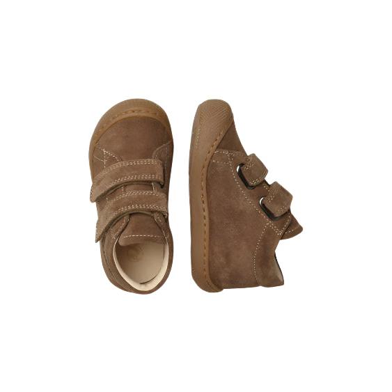 Pair of brown children's shoes with velcro straps on a white background