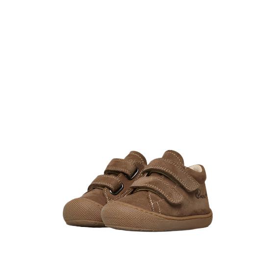 Pair of brown children's shoes with velcro straps on a white background