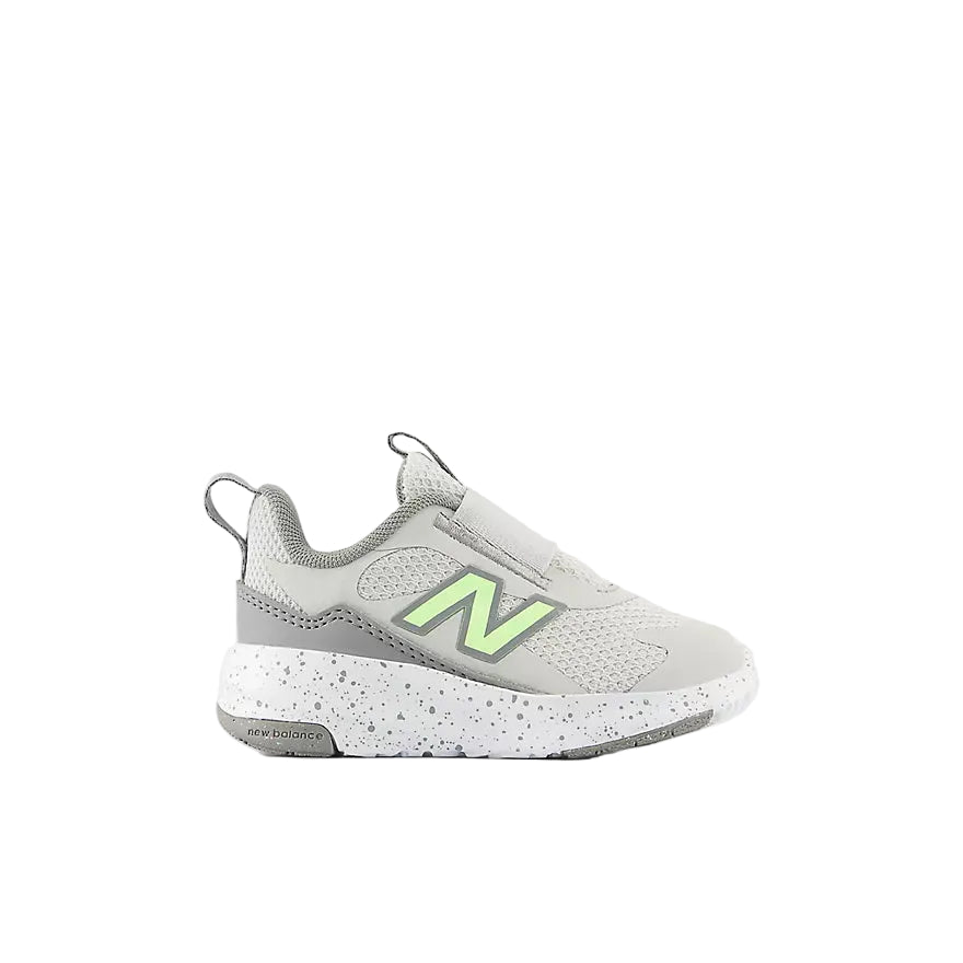 Gray sneaker with green accents on a white background
