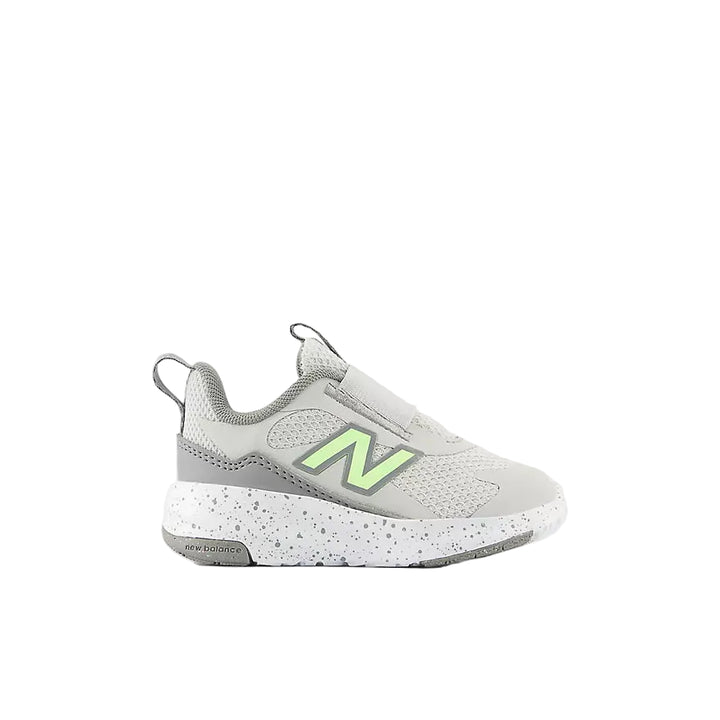 Gray sneaker with green accents on a white background