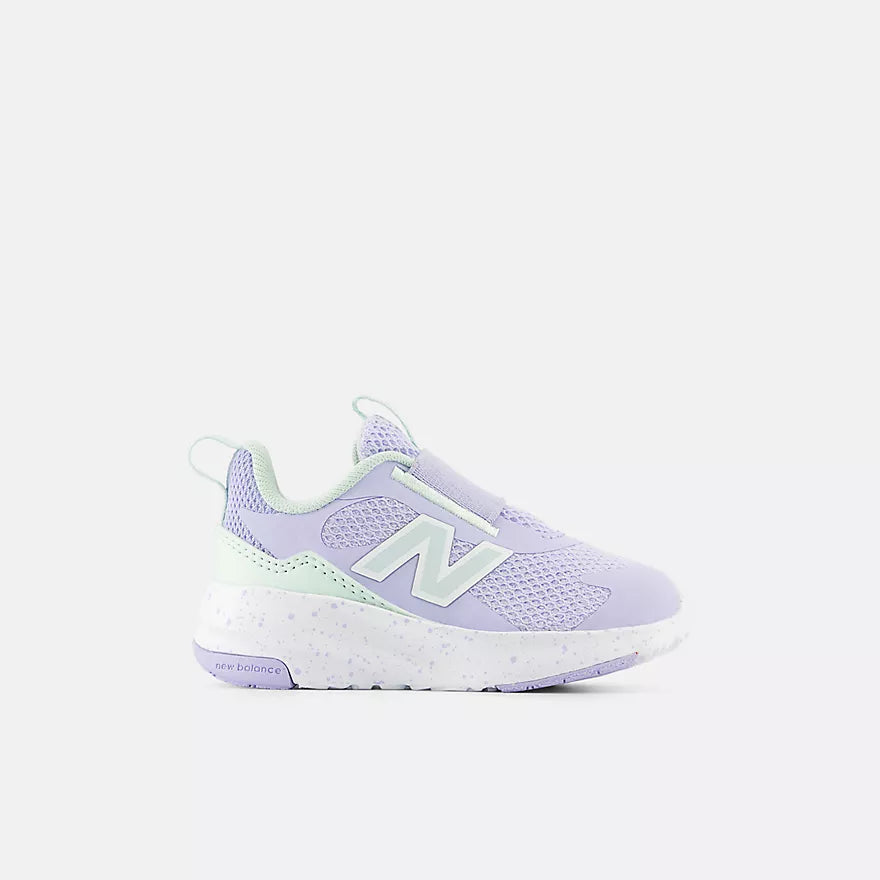 Purple and green sneaker with New Balance logo on a white background